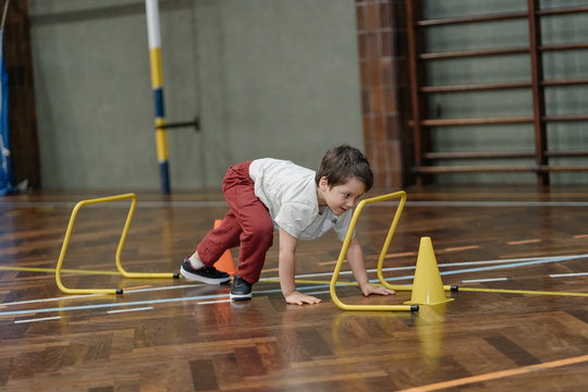 Child Playing In The Gym.