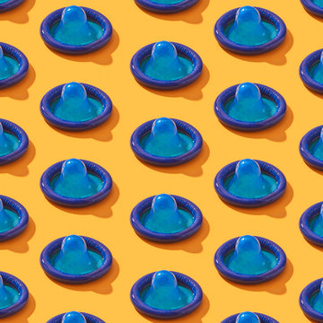 Blue condoms pattern with shadows .