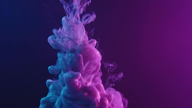 Ink water splash. Supernatural explosion. Pearl fluid cloud in purple blue neon light.