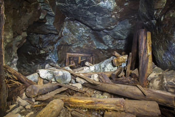 Underground abandoned platinum ore mine tunnel collapsed wooden timbering