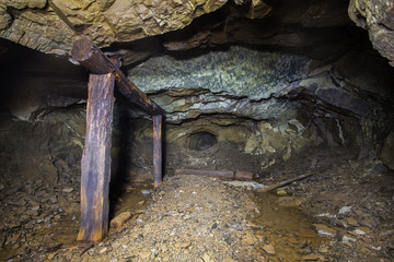 Underground abandoned platinum ore mine tunnel collapsed wooden timbering
