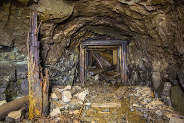 Underground abandoned platinum ore mine tunnel collapsed wooden timbering