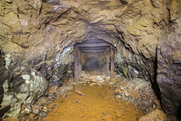 Underground abandoned platinum ore mine tunnel collapsed wooden timbering