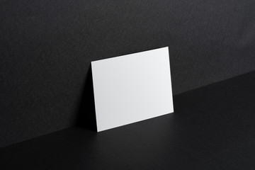 White businesscards on black background close up, copy space