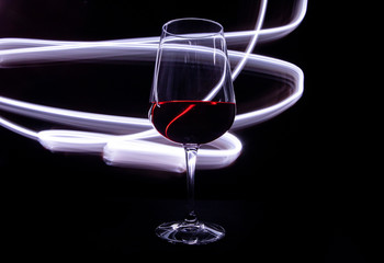 Wine glass with white lights in the background