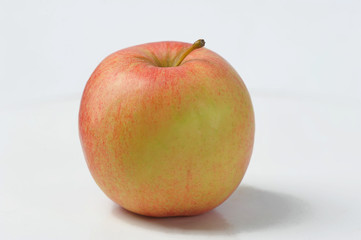 Apple on a white background - juicy yellow-red Apple