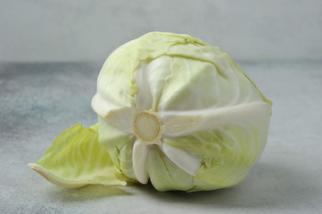cabbage on gray background - cabbage head and cabbage leaf