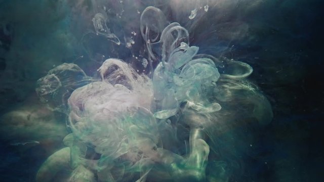 Color fluid splash. Ethereal energy. Pearl first light pink crystalline gray paint mix in water.