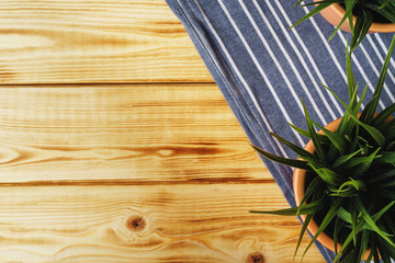 Kitchen towel or napkin over the wooden table. Close up.
