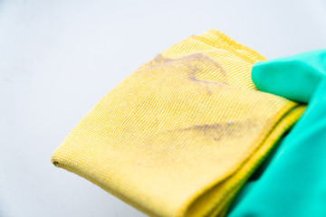 close up dust on a yellow rag after cleaning
