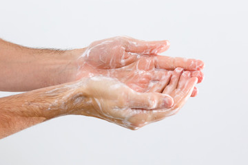 Fototapeta premium man washing hands isolated over white background