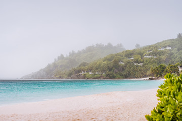 Fototapeta na wymiar Tropical rain covered Anse Intendance beach on Mahe island in Seychelles