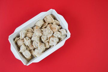 Delivery of ready-made food. A box of dumplings from a restaurant