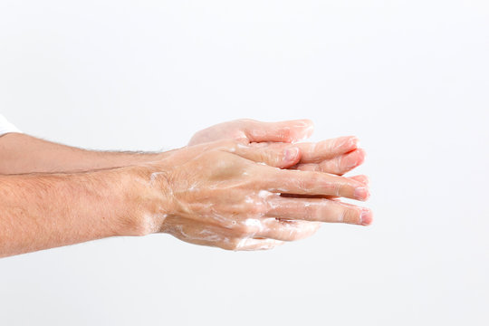 Close up image of washing hand against white background