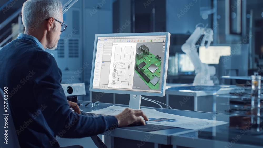 Leinwandbilder Engineer Works on Computer Uses CAD Software to Design 3D Industrial Machinery Component. In the Background Robot Arm Concept Standing in Heavy Industry Engineering Facility. Over the Shoulder Shot