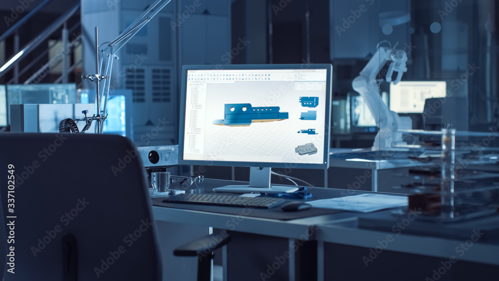 Fototapete  On the Desk Computer With CAD Software and Design of 3D Industrial Machinery Component. In the Background Robot Arm Concept Standing in Heavy the Dark.Industry Engineering Facility.