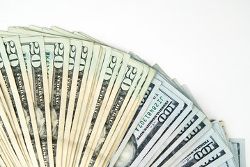 Fan of US money against a white background