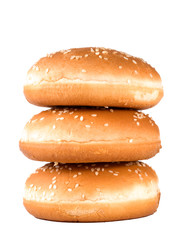 Three hamburger buns with sesame isolated on white background.