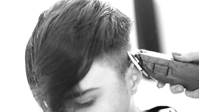 haircut work on young man in black and white