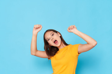 young woman with hands up