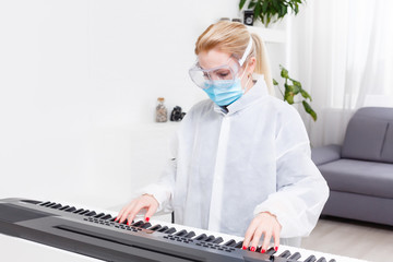 woman doctor in a protective mask plays the piano