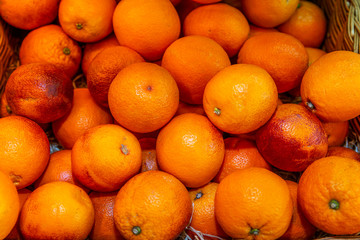 Red Sicilian oranges on a counter in a supermarket. Close-up. Top view. Strengthening immunity during the coronavirus pandemic.