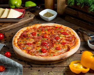 pepperoni pizza with tomato bell peppers herbs and cheese _