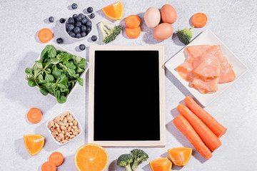 Foods that help maintain eyes healthy, products for keeping good vision. Black board with copy...