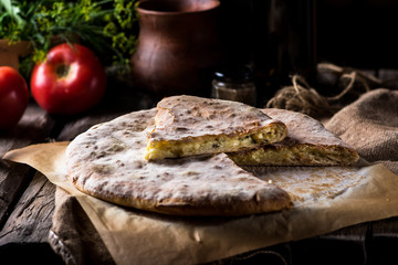 Khachapuri in Adjarian. Open pie with mozzarella and egg. Georgian cuisine. Still life of food. suluguni cheese. Georgian bread. Piece of pie. Cheese pie