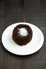 portioned chocolate cake with coconut sprinkles