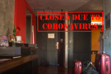 Defocused view of interior of an upmarket hotel room, empty and closed due to coronavirus