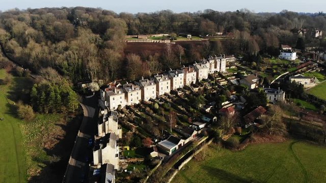 Wide aerial, suburban town in rural countryside