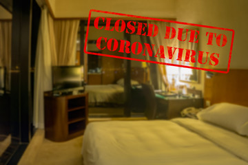 Defocused view of interior of an upmarket hotel room, empty and closed due to coronavirus