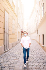 Obraz na płótnie Canvas Young man background the old european city take selfie