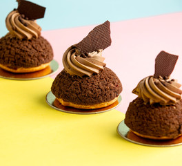 small cacao mountains cookies garnished with cacao cream and chocolate