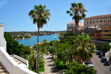 harbour view with palm trees in the city of mahon menorca spain