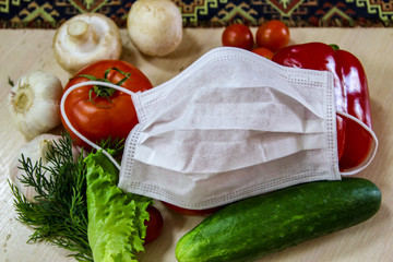 vegetables protected by a medical mask from the pandemic-19 pandemic virus