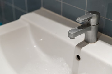 close-up tap or faucet in bathroom, no water