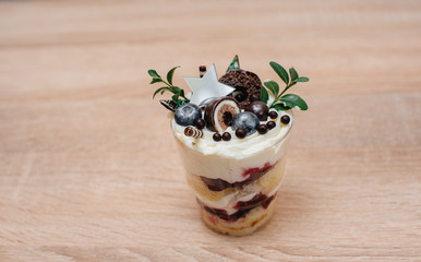 A beautiful and mouth-watering close-up trifle on a table with space for a signature. Cake