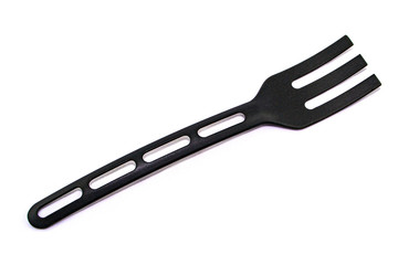 black plastic fork on white background