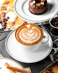 a cup of coffee with latte art and sugar sprinkles