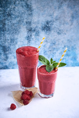 Close up of red smoothie with raspberries