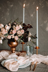 Fabric cloth table decoration peach pastel color motif perfect for any event or wedding occasion. Table floral decorative with silk ribbon.