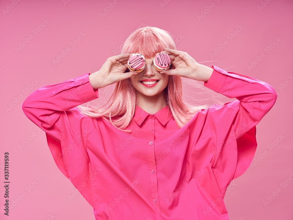 Wall mural young woman in pink dress