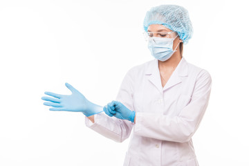 Young woman doctor in white uniform wearing mask and gloves isolated on white background