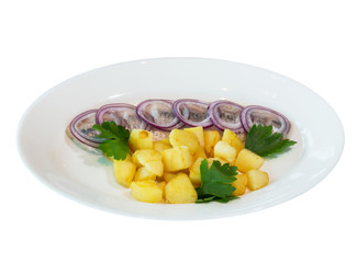 A portion of fried potatoes with salted herring under fresh onions on a white plate. on white background