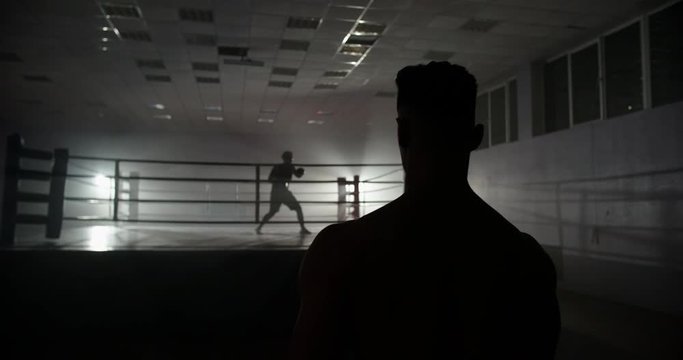 A motivated muay thai sportsman walking towards sparring ring, ready for a fight - martial arts, way to success concept 4k footage