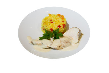 a dish of stewed turkey with a portion of vegetable rice pilaf