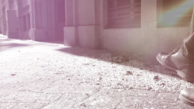 Cinematic color graded slow motion of woman feet playing with dried leaves on empty street during coronavirus covid 19 - virus pandemic situation in France - general lockdown