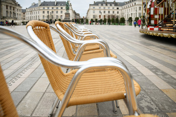 Wicker chairs in the main square of Orleans